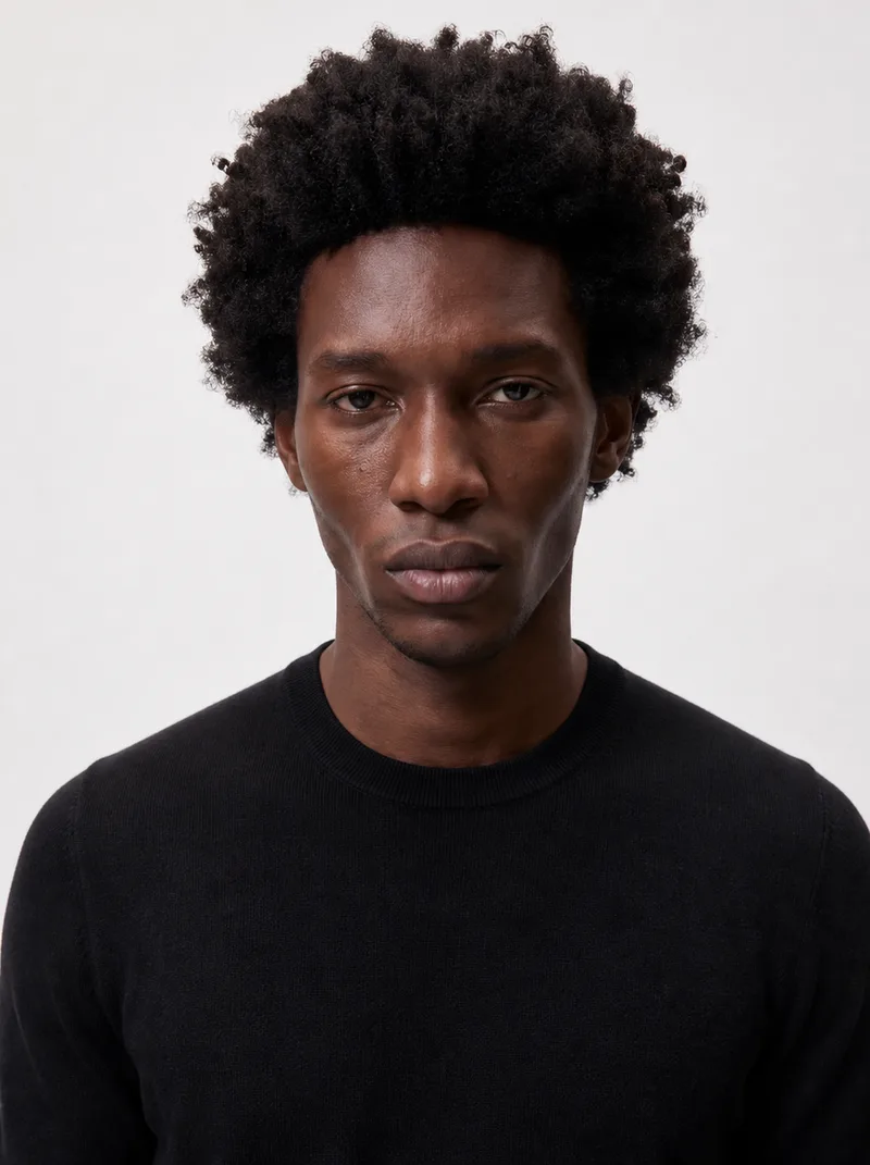 George — AI fashion model with a short rounded afro